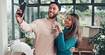 Couple, keys and selfie in new home with hug, smile or excited for relocation with property investing. People, happy and moving with social media, embrace or real estate with post on web at apartment