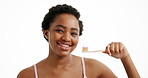Dental health, face and black woman brushing teeth in studio for wellness, grooming or hygiene. Oral care, happy and portrait of African person with toothbrush for fresh breath by white background.