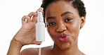 Container, cream and face of black woman in studio for advertising or marketing of beauty product. Bottle, lotion and moisturizer with funny African model pouting on white background for skincare