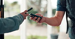 Hands, phone and payment with courier at front door with easy transaction, tap and paperless sale. Delivery man, client and mobile app for pos, machine and fintech with ecommerce order at apartment