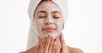 Skincare, face wash and woman in studio with natural, beauty or clean facial routine in morning. Towel, cleanser and female person with dermatology treatment for hydration by white background.