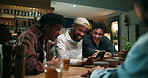 Pub, men and funny friends with mobile for meme, social media and laugh with comedy online. Phone, bar and group conversation together to show video on app, share joke and drink beer on night out