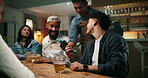 Man, friends and waiter at bar for payment, pos or tap phone with paperless transaction on night out. Person, group and smartphone for mobile app, fintech and tips bartender for customer experience