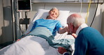 Holding hands, kiss and old woman in hospital with husband for recovery from operation. Healthcare, medical and support with senior couple in clinic together for rehabilitation, treatment or wellness