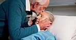 Senior, couple or patient in hospital with kiss, sleeping or recovery from medical surgery. Love, elderly or married people in healthcare center for healing, support or cancer treatment in clinic