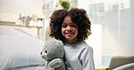 Face, healthcare and teddy bear with boy in hospital for appointment, checkup or recovery. Cuddle toy, medical and smile of African child on bed in clinic for pediatric examination as patient