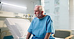 Breathing, sick and old man in hospital, cancer and illness with anxiety, contemplation and sad. Healthcare facility, patient and senior person with stress, tired and chronic disease with fatigue
