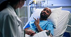 Man, patient and talk to doctor in hospital bed for checkup, medical report and explain symptoms. Male person, rest and healthcare worker with clipboard, monitor post surgery and recovery information