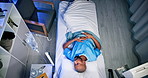 Above, speed and black man in hospital bed, sleeping and illness with break, calm and movement. African person, fast and patient in clinic, disease and relax with rest, peaceful and healthcare
