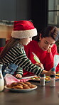 Cookies, baking and Christmas with mother and daughter in kitchen for bonding, holiday season and help. Santa snack, support and festive dessert with woman and kid in family home for frosting