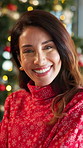 Woman, smile and face by Christmas tree in home, pride and excited for holiday with festive sweater. Person, happy and portrait with decoration, xmas or tradition with celebration at house in England