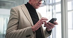 Office, online and business man with phone for stock market news, website and investment research. Professional, corporate and mature person on smartphone for internet, connection or financial update