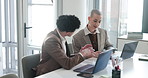 Laptop, meeting and business people with documents in office for finance review, revenue or budget report. Team, corporate and man with woman on computer for financial proposal, planning and graph