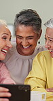 Senior friends, phone and laughing in home for funny online post, social media meme or bonding. Retirement, happy and women with smartphone in apartment for comedy video, reunion visit or connection