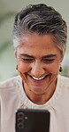 Smile, senior woman and laughing with phone for research, social media and reading funny meme. Happy, elderly person and mobile app of comedy video, browsing website and message notification at house