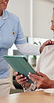 Home, nurse and senior woman with tablet, conversation and kindness with medical service. Pensioner, apartment and elderly person with caregiver, tech and online reading with internet, app or support