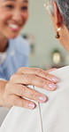 Hand on shoulder, nurse and senior woman with support, retirement and help with medical service. Hospice caregiver, elderly person and pensioner with comfort, wellness and gesture with consultation