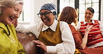 Women, relax and friends laughing at house for discussion, gossip and funny story for bonding. Mature people, talking and listening to joke, group reunion and chat for conversation at get together 