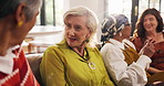 Mature women, friends and talk at house for discussion, gossip and share story for bonding together. People, conversation and listen to advice, group reunion and chat for catchup at social gathering