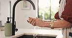Mature woman, hands and washing with water in kitchen for hygiene, disinfection or cleaning in home. Female person, rinse or sink with tap or soap for cleanliness, bacteria or germ removal in house