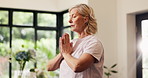 Fitness, meditation and yoga with senior woman in living room of home for awareness or balance. Breathing, exercise and zen with mature person in apartment for inner peace, mindfulness or wellness