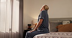 Mature woman, stretching neck and bed for wake up, muscle relief and routine to start day. Female person, warm up and circulation from sleep, getting ready and mobility movement for stiffness in home