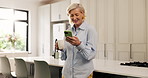 Scroll, phone and old woman in kitchen with coffee, internet comedy and laughing at social media post. Happy, senior and female person in home with morning drink, funny video or online entertainment.