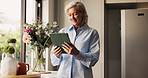 Small business, smile and tablet with woman in home for planning, remote work or research. App, happy and startup with mature freelance entrepreneur in apartment for browsing or connectivity