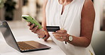 Woman, hands and phone with credit card on laptop for online shopping or remote banking app. Female person, shopper or virtual payment with debit, mobile smartphone or computer for ecommerce in home
