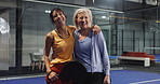 Fitness, women and face on court for padel tournament, game win or sportsmanship. Athletes, mature people and team hug with celebration at health club for friendly match, competition or challenge