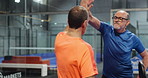 Fitness, men and high five on court for padel tournament, game win or sportsmanship. Athletes, mature people and team with celebration at health club for friendly match, competition or challenge