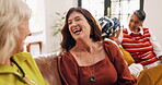 Happy, women and friends laughing at house for discussion, gossip and funny story for bonding. Mature people, talking and listening to joke, group reunion and chat for conversation at get together 