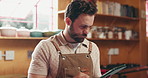 Tablet, man and chef in kitchen with recipe for meal research in restaurant with culinary information. Digital technology, reading and male industry worker with app for food prep tutorial in diner.