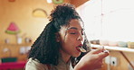 Tasting, dish and woman in kitchen, chef and delicious food for hospitality, culinary skills or meal. Eating, cuisine and quality control of flavor, happy and person with satisfaction in restaurant
