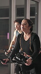 Cycling, workout and coaching with woman in spin class for cardio fitness, health and challenge. Personal trainer, stationary bike and performance with person in sports club for teaching and training