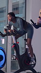 Fitness, spin class and woman on bike in gym for exercise, cardio workout and cycling for wellness. Sports center, health and person on stationary machine for muscle strength, endurance and training