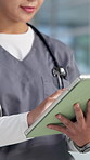 Hospital, nurse and hands of woman on tablet for online results, medical service and research. Healthcare, clinic and person typing on digital tech for surgery schedule, diagnosis and patient report
