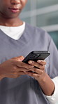 Hands, doctor and woman in hospital, smartphone and typing with social media, app and internet. Telehealth, professional and person in clinic, cellphone or email with communication or online chatting
