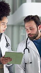 Hospital, meeting and doctors on tablet talking for online results, medical service and advice. Healthcare, clinic and woman with man on digital tech for surgery schedule, diagnosis or patient report