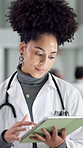 Hospital, typing and doctor on tablet walking for online results, medical service and research. Healthcare, clinic and woman on digital tech for surgery schedule, diagnosis update and patient report