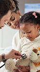 Stuffed animal, stethoscope and pediatrician with child in hospital for asthma, consulting and medical advice. Breathing assessment, healthcare exam and toy game with mother and kid with doctor