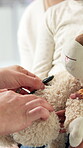 Stuffed animal, stethoscope and hands of pediatrician with child for asthma, consulting and medical advice. Breathing assessment, healthcare exam and toy game with mother and kid with doctor