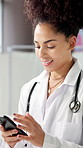 Typing, phone and happy doctor in hospital for online chat, website and advice on health app. Healthcare, clinic and woman on smartphone for research, connection and medical service for telehealth
