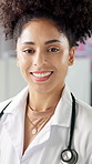 Face, doctor and woman in hospital, smile and career ambition with confidence, worker and pride. Person, medical service and professional in clinic, healthcare and stethoscope with happiness