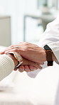 Hands together, doctor and patient in clinic, compassion and empathy with healthcare. Sympathy, closeup and people with medical diagnosis, professional and wellness with trust, comfort and support