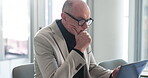 Office, anxiety and man with laptop, thinking or idea for investment proposal, employee and research. Serious, accountant and mature person with tech for financial analysis, reflection and stress