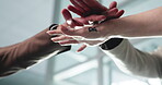 Hands, team building and motivation in office for synergy, solidarity and collaboration for company goals. Below, employees and people in workplace for huddle, cooperation and business development.