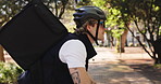 Man, bicycle and courier service with backpack in park for travel, package or parcel transportation. Male person, commute or outdoor ride with bike, helmet or bag for eco friendly delivery in nature