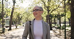 Glasses, walking or business woman in park, happy professional or ready for new job opportunity. Corporate career, first day or employee travel with eyewear in nature,   happiness and morning commute