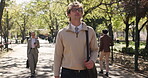 Business, man and walking in park with vision, reflection and opportunity for career growth. Morning journey, male employee and person outdoor with thought, travel and daily commute to workplace.